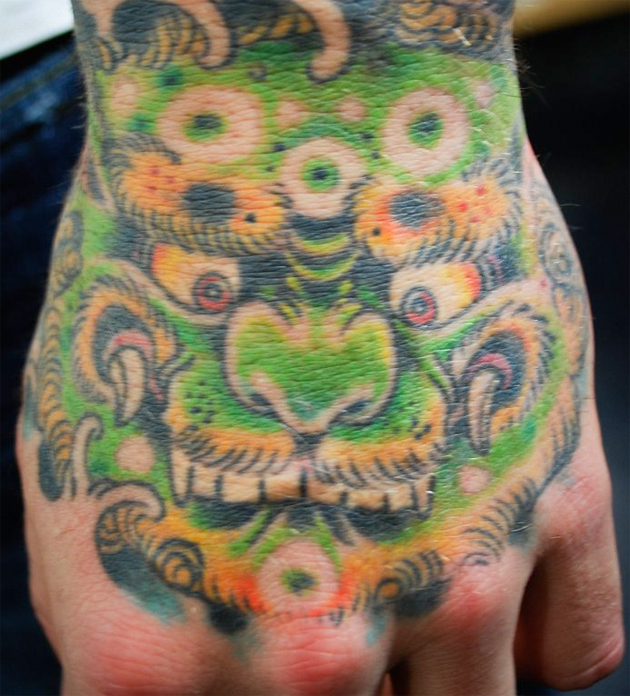monster hand tattoo
