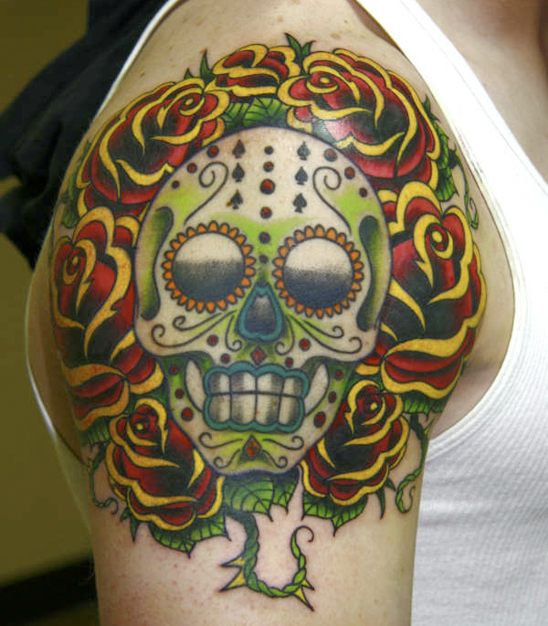 For today's feature we came across this half sleeve tattoo of a Sugar Skull