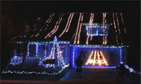 Guitar Hero Played on a House with Christmas Lights